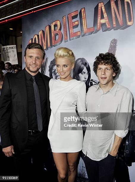 Director Ruben Fleischer, actors Amber Heard and Jesse Eisenberg arrive at the premiere of Sony Pictures' "Zombieland" at the Chinese Theater on...