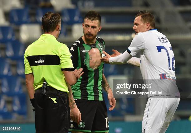 Referee Paolo Valeri speaks with Francesco Acerbi of US Sassuolo and Josip Ilicic of Atalanta during the serie A match between US Sassuolo and...