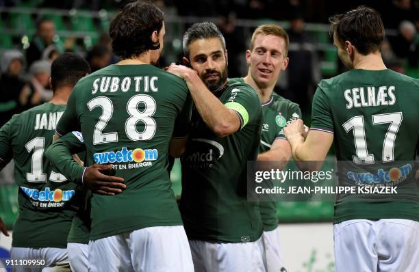 Saint-Etienne's players celebrate after scoring a goal during the French L1 football match Saint-Etienne vs Caen on January 27 at the Geoffroy...