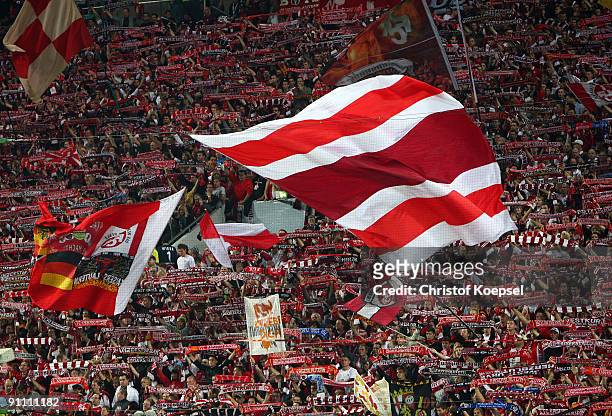 The fans of Kaiserslautern wave flags prior to the DFB Cup second round match between 1. FC Kaiserslautern and Bayer Leverkusen at...