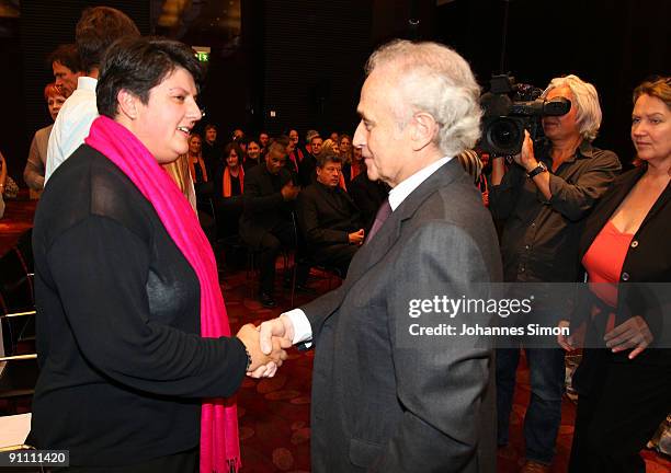 Opera singer Jose Carreras, founder of the Jose Carreras Leukaemia foundation and the mother of a leukaemia ill child talk together after the...