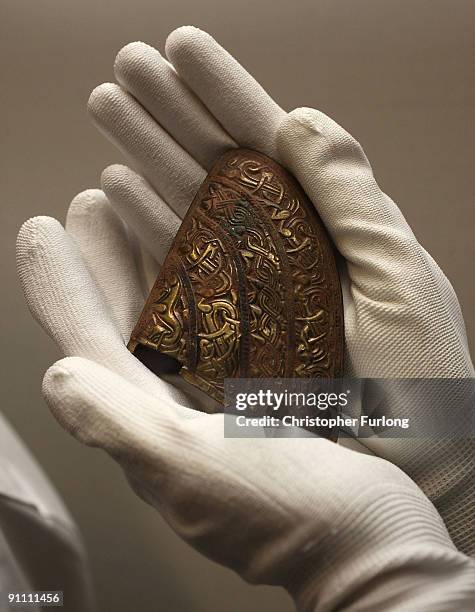 Section from the cheek plate of a helmet is displayed as part of the The Staffordshire Hoard, the UK's largest collection of Anglo Saxon treasure...