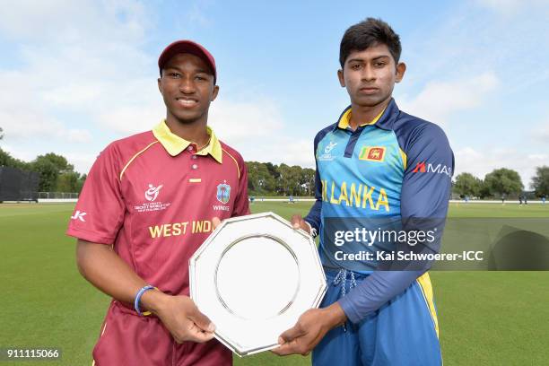 Captains Emmanuel Stewart of the West Indies and Kamindu Mendis of Sri Lanka pose with the trophy prior to the ICC U19 Cricket World Cup Plate Final...