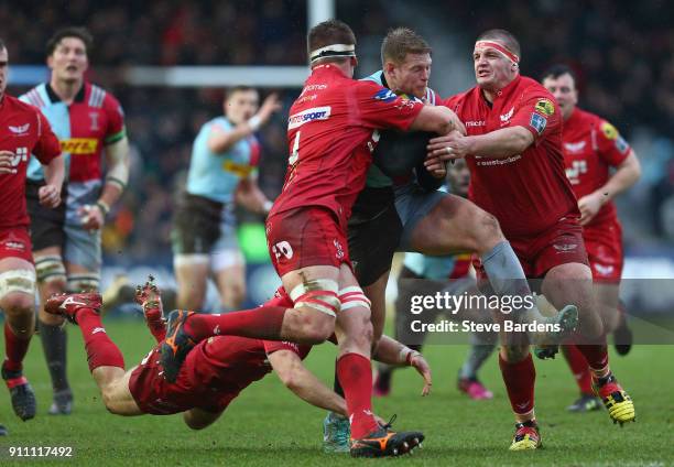 Henry Cheeseman of Harlequins takes on the Scarlets defence during the Anglo-Welsh Cup match between Harlequins and Scarlets at Twickenham Stoop on...