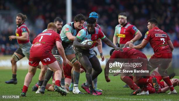 Gabriel Ibitoye of Harlequins takes on the Scarlets defence during the Anglo-Welsh Cup match between Harlequins and Scarlets at Twickenham Stoop on...