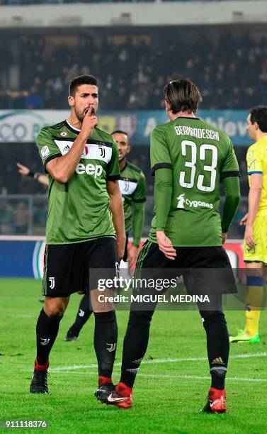 Juventus' German midfielder Sami Khedira reacts after scoring during the Italian Serie A football match AC Chievo vs Juventus at the...