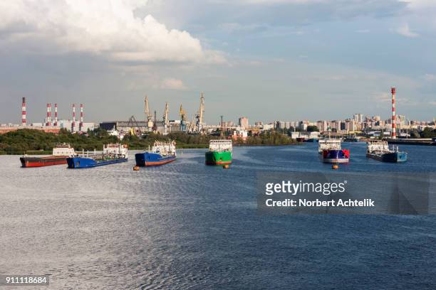 oil tanker ships and cranes at merchants harbor, saint petersburg, russia - russia oil stock pictures, royalty-free photos & images