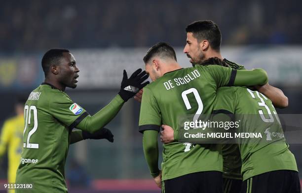 Juventus' Germain midfielder Sami Khedira is congratulated by teammates after scoring a goal during the Italian Serie A football match AC Chievo vs...