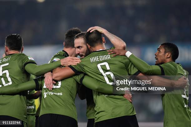 Juventus' Germain midfielder Sami Khedira is congratulated by teammates after scoring a goal during the Italian Serie A football match AC Chievo vs...