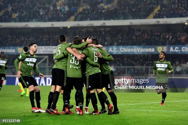 Juventus' Germain midfielder Sami Khedira is congratulated by teammates after scoring a goal during the Italian Serie A football match AC Chievo vs...