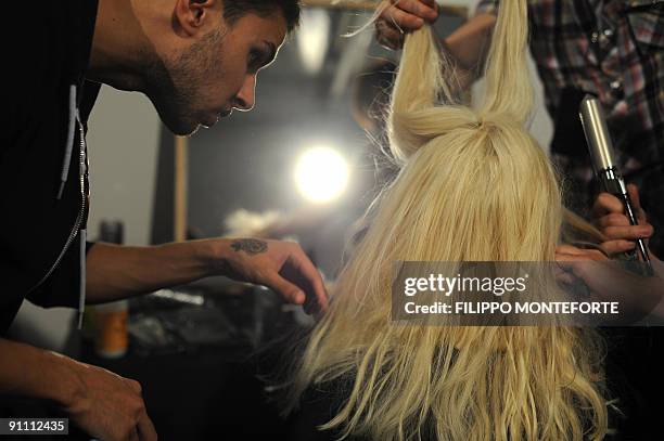 Model gets ready prior Just Cavalli Spring/Summer 2010 ready-to-wear fashion collection on September 24, 2009 during the Women's fashion week in...