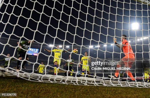 Juventus' Argentinian forward Gonzalo Gerardo Higuain heads the ball to score a goal during the Italian Serie A football match AC Chievo vs Juventus...