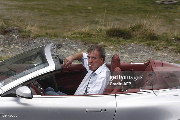 British television BBC presenter of motor show "Top Gear" Jeremy Clarkson is pictured while he drives an Aston Martin car on Transfagarasan road...