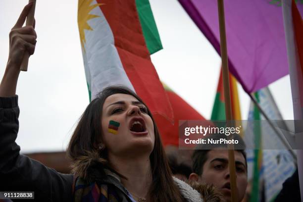 Young kurdish woman shouts slogan against Recep Tayyip Erdogan. Kurds demonstrate against the turkish attack on Afrin in Syria launched by Erdogan...