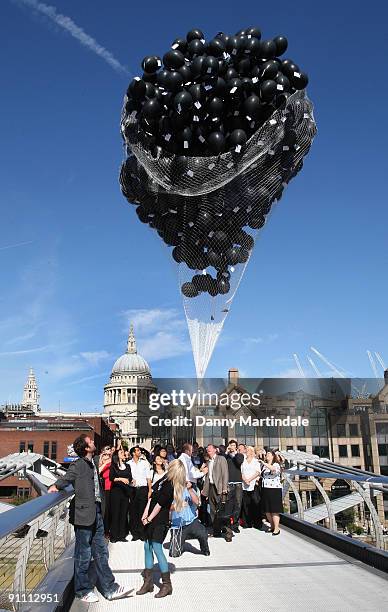 Actors Evanna Lynch and Matthew Lewis release 1,000 balloons on the Millennium Bridge to mark the DVD release of Harry Potter And The Half-Blood...