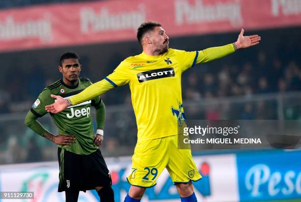 Chievo's Italian defender Fabrizio Cacciatore reacts after receiving a red card during the Italian Serie A football match AC Chievo vs Juventus at...