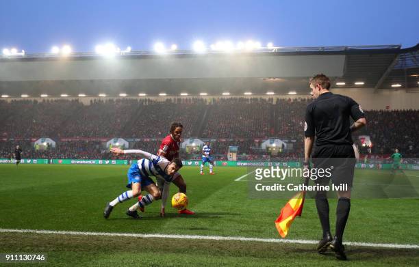 General view as the assistant referee watches Jack Robinson of Queens Park Rangers battle with Bobby Reid of Bristol City during the Sky Bet...