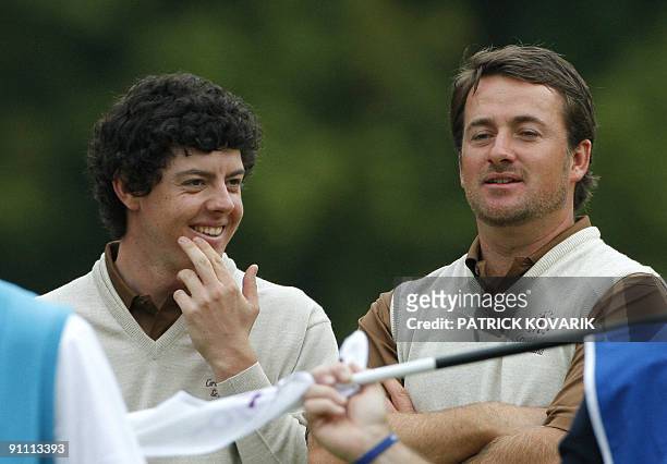 Northern Ireland golfer Rory McIlroy talks with teammate Northern Ireland Graeme McDowell during the Vivendi Trophy golf Open on september 24 2009,...