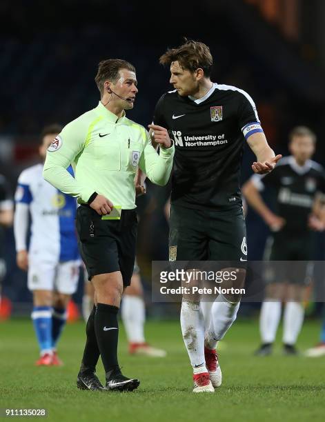 Ash Taylor of Northampton Town makes a point to referee Anthony Backhouse during the Sky Bet League One match between Blackburn Rovers and...