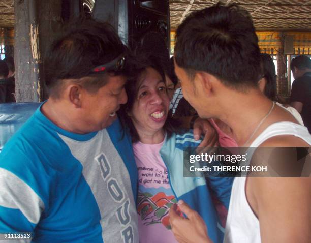 Jocelyn Inion , one of the kidnapped female teachers is greeted by relatives in Sibugay, near Zamboanga city in Mindanao island on September 24, 2009...