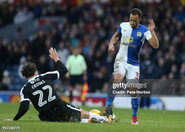 Elliott Bennett of Blackburn Rovers contests the ball with Matt Crooks of Northampton Town during the Sky Bet League One match between Blackburn...