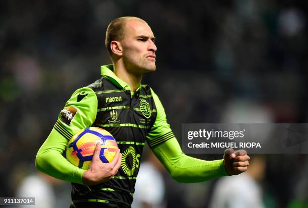 Sporting's Dutch forward Bas Dost celebrates after scoring a goal during the Portuguese Cup final football match between Vitoria FC and Sporting CP...