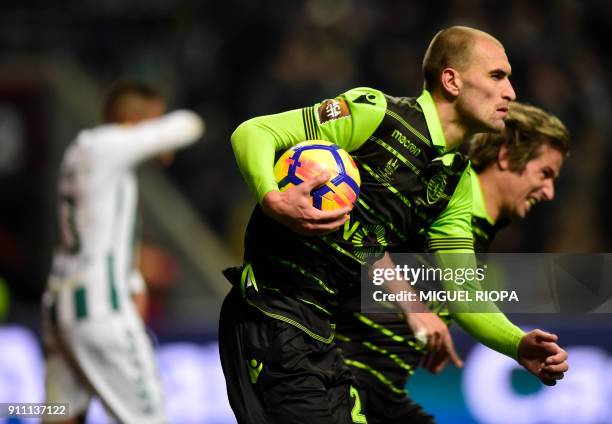 Sporting's Dutch forward Bas Dost celebrates after scoring a goal during the Portuguese Cup final football match between Vitoria FC and Sporting CP...