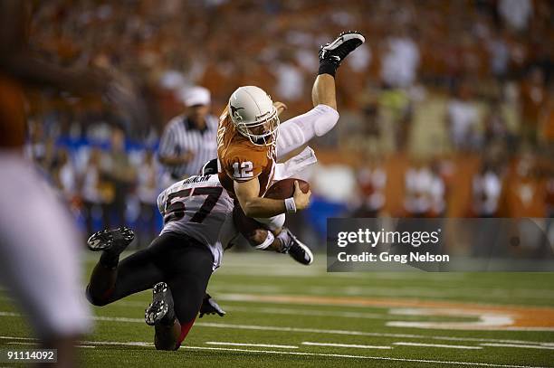 Texas Colt McCoy in action, flipped vs Texas Tech Brian Duncan . Austin, TX 9/19/2009 CREDIT: Greg Nelson