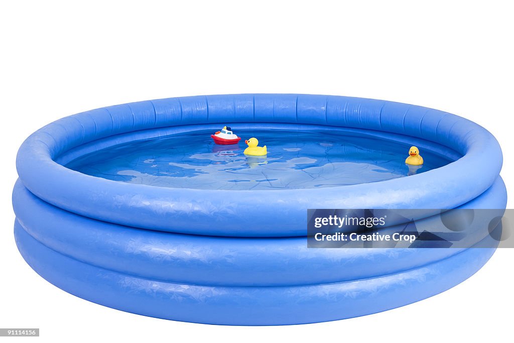 Inflatable swimming pool with rubber duck and toy
