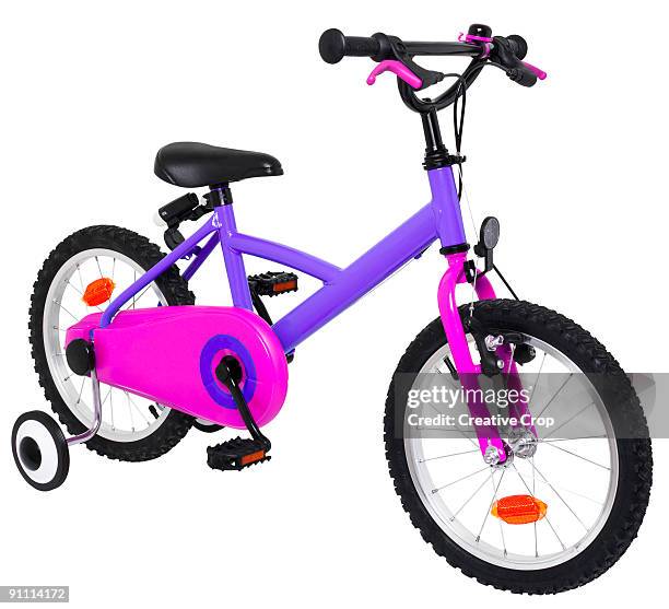 child's push bike, with stabilisers - training wheels stock pictures, royalty-free photos & images