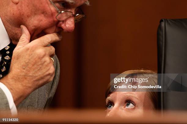 Senate Finance Committee member Sen. Pat Roberts listens to a staff member during a mark up session on the health care reform legislation on Capitol...