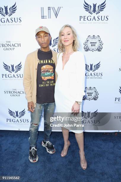 Pharrell Williams and Belinda Stronach attend The $16 Million Pegasus World Cup Invitational, The World's Richest Thoroughbred Horse Race at...