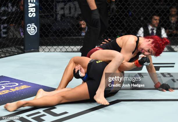 Randa Markos of Iraq controls the body of Juliana Lima of Brazil in their women's strawweight bout during a UFC Fight Night event at Spectrum Center...