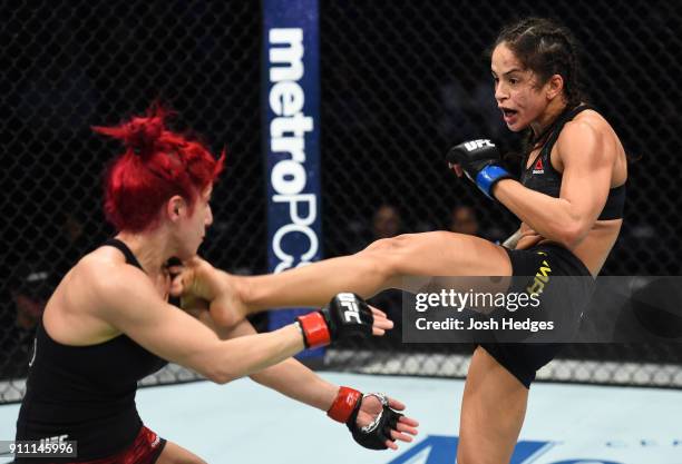 Juliana Lima of Brazil kicks Randa Markos of Iraq in their women's strawweight bout during a UFC Fight Night event at Spectrum Center on January 27,...