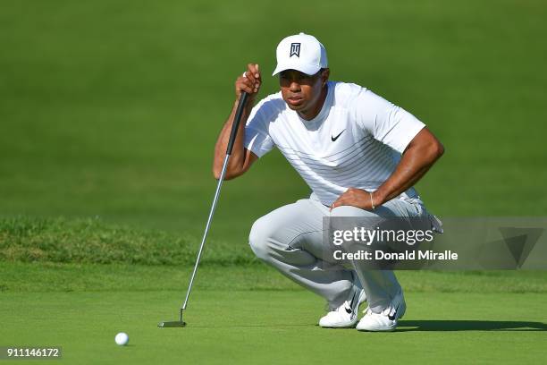 Tiger Woods looks over a putt on the fifth green during the third round of the Farmers Insurance Open at Torrey Pines South on January 27, 2018 in...