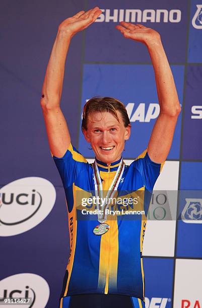 Gustav Larsson of Sweden celebrates finishing second in the Elite Men's Time Trial at the 2009 UCI Road World Championships on September 24, 2009 in...