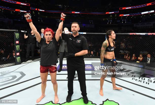 Randa Markos of Iraq celebrates her victory over Juliana Lima of Brazil in their women's strawweight bout during a UFC Fight Night event at Spectrum...