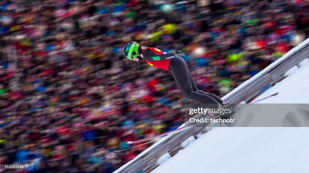 Side View of Female Ski Jumper Landing