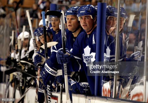 Mike Komisarek and Tomas Kaberle of the Toronto Maple Leafs watch from the bench during a pre-season NHL game against the Pittsburgh Penguins at the...