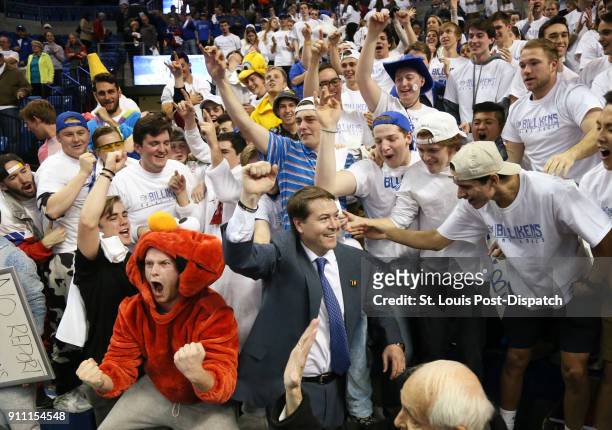 St. Louis University head coach Travis Ford celebrates with fans in the student section after a 75-65 win against Dayton on Saturday, Jan. 27 at...