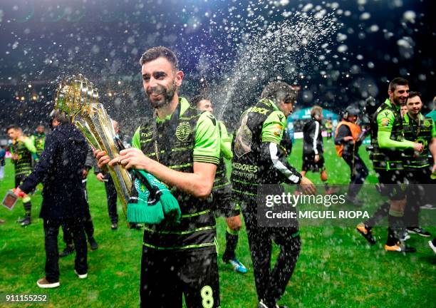Sporting's Portuguese midfielder Bruno Fernandes celebrates after winning the Portuguese Cup final football match between Vitoria FC and Sporting CP...