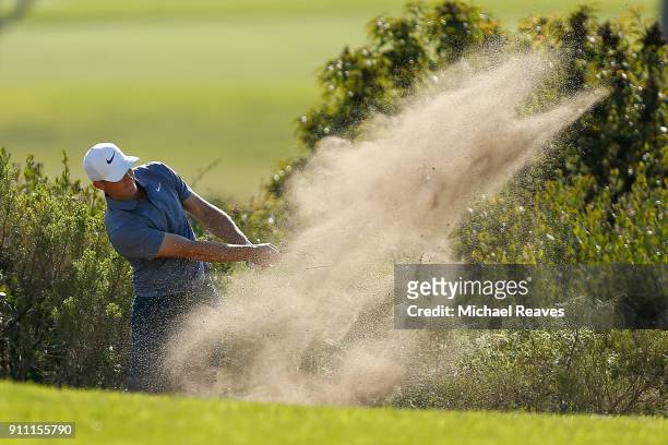 Alex Noren of Sweden plays his second shot from the bunker on the 14th hole during the third round of the Farmers Insurance Open at Torrey Pines...