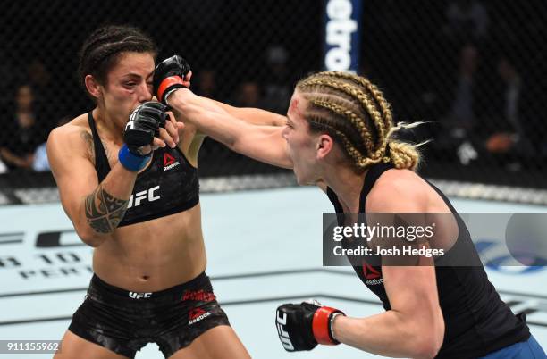 Katlyn Chookagian punches Mara Romero Borella of Italy in their women's flyweight bout during a UFC Fight Night event at Spectrum Center on January...