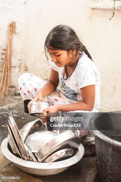 indian girl washing dishes in local village. - kitchen equipment stock pictures, royalty-free photos & images