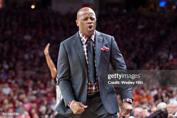 Head Coach Mike Anderson of the Arkansas Razorbacks reacts to a foul call during a game against the Oklahoma State Cowboys at Bud Walton Arena on...