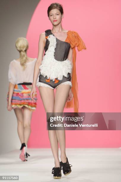 Model walks down the runway during the Moschino Cheap & Chic Fashion Show as part of the Milan Womenswear Fashion Week Spring/Summer 2010 at the...