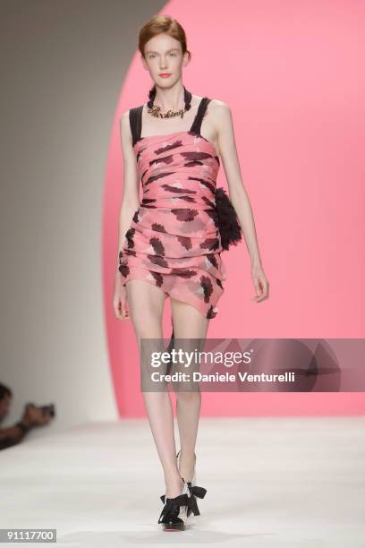 Model walks down the runway during the Moschino Cheap & Chic Fashion Show as part of the Milan Womenswear Fashion Week Spring/Summer 2010 at the...