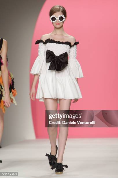 Model walks down the runway during the Moschino Cheap & Chic Fashion Show as part of the Milan Womenswear Fashion Week Spring/Summer 2010 at the...