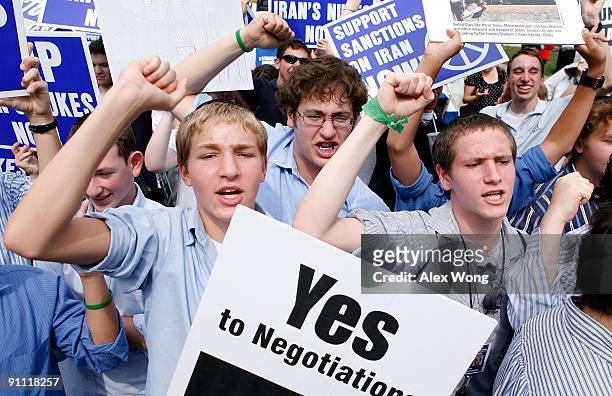 Students Sholom Reches, Joey Sacharow and Etan Dinnerman of Yeshivat Rambam, a Jewish school in Baltimore, shout slogans during an anti-nukes rally...