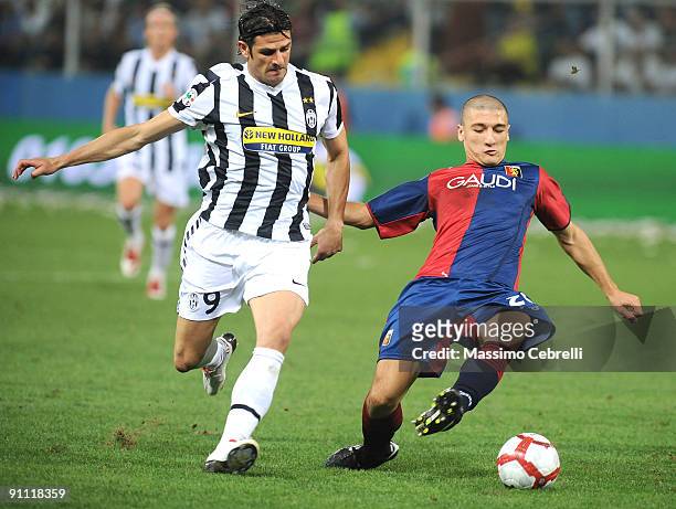 Salvatore Bocchetti of Genoa CFC and Vincenzo Iaquinta of Juventus FC compete for the ball during the Serie A match between Genoa CFC and SSC...